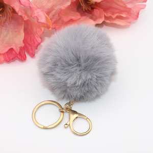 Grey Pom Pom with Gold Claw Clasp