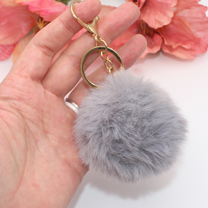 Grey Pom Pom with Gold Claw Clasp